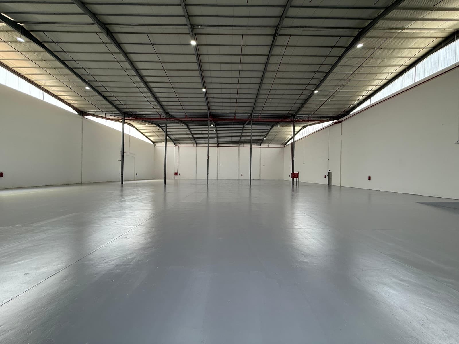 Indoor storage space with height suited to material handling